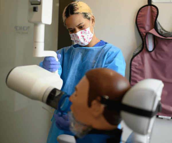 Dental Assistant Performing Xray